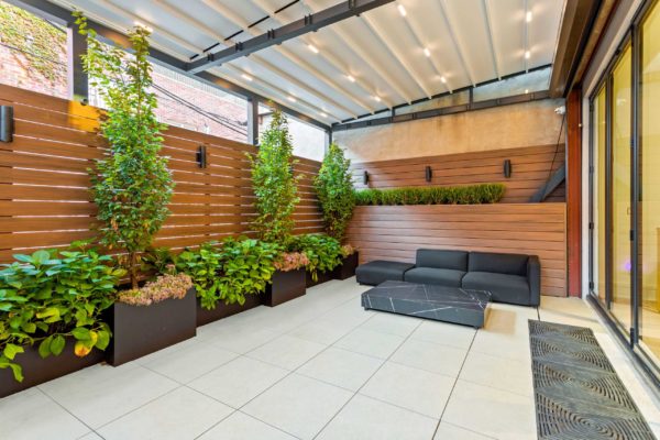 Sofa, coffee table, custom planters, custom pavers, with closed roof